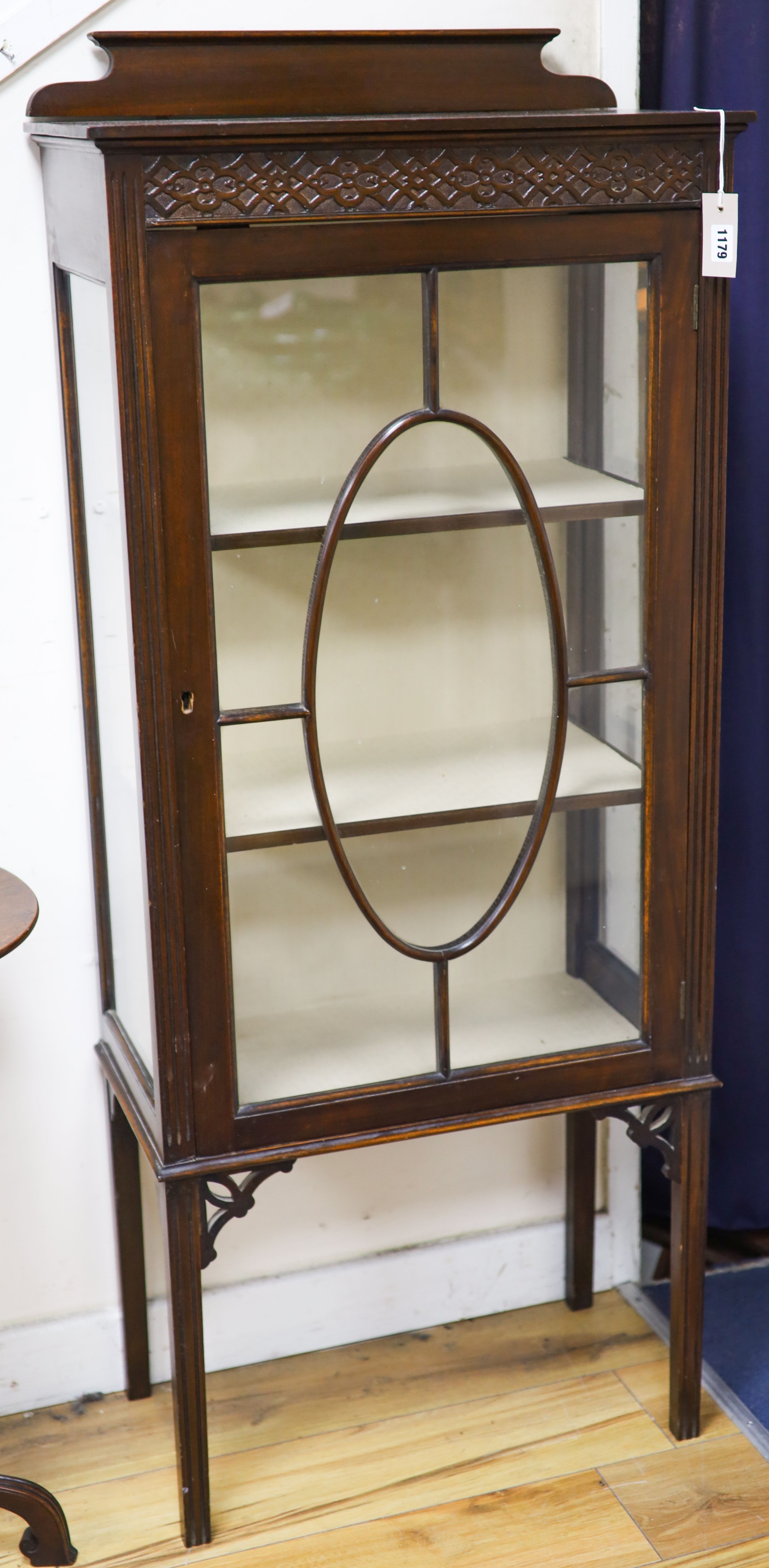 A small mahogany display cabinet, width 58cm, depth 32cm, height 140cm